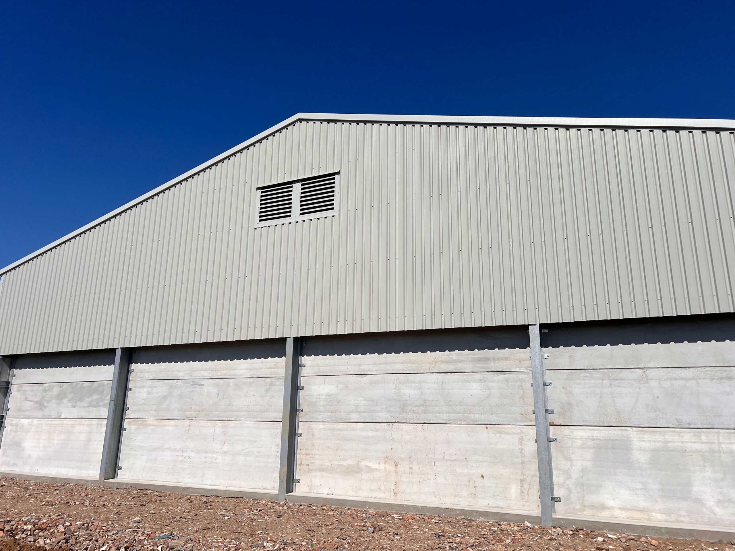 Metal roof and wooden sides on building created by K and J construction