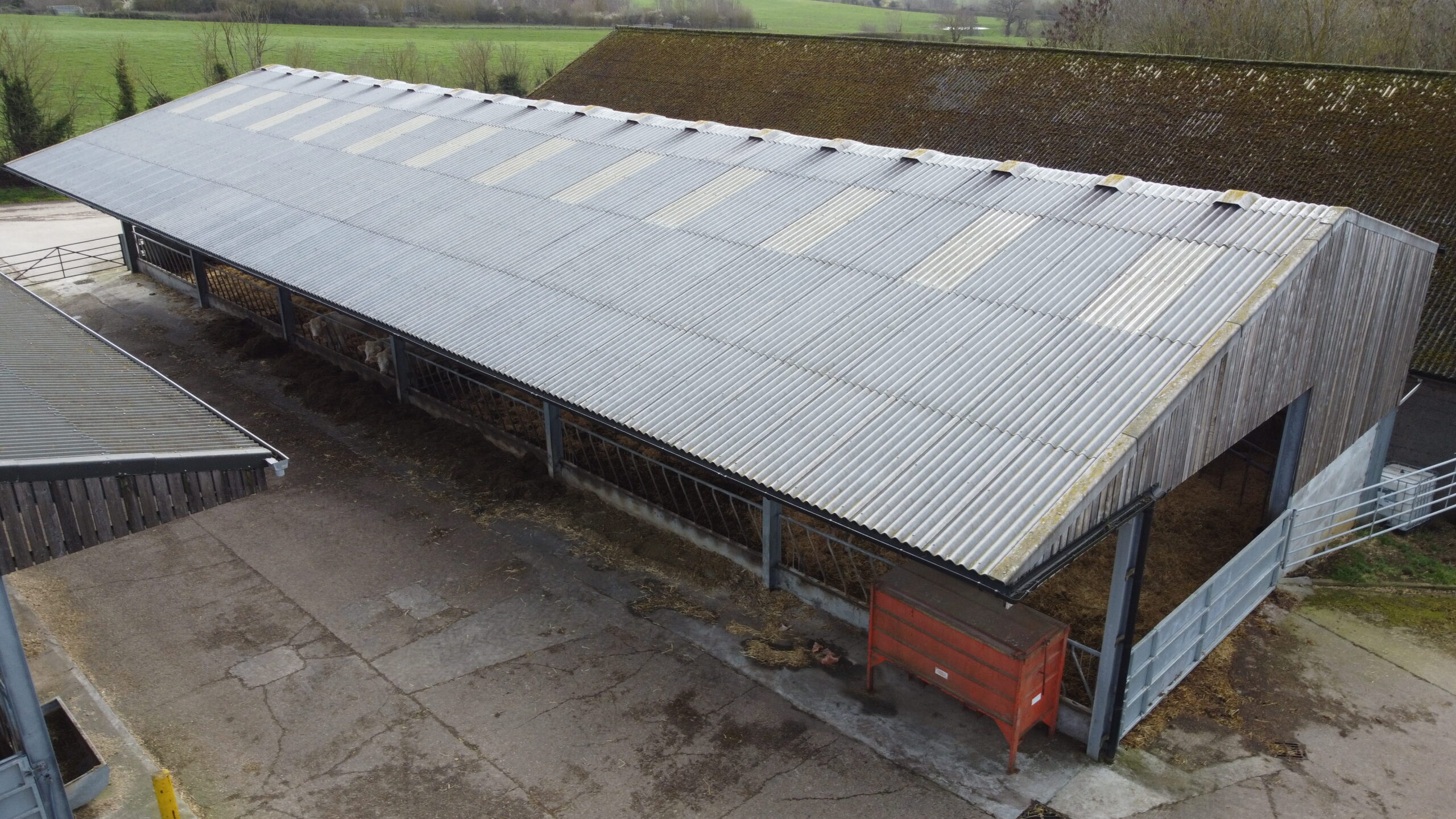 Image of cattle shed with a metal roof