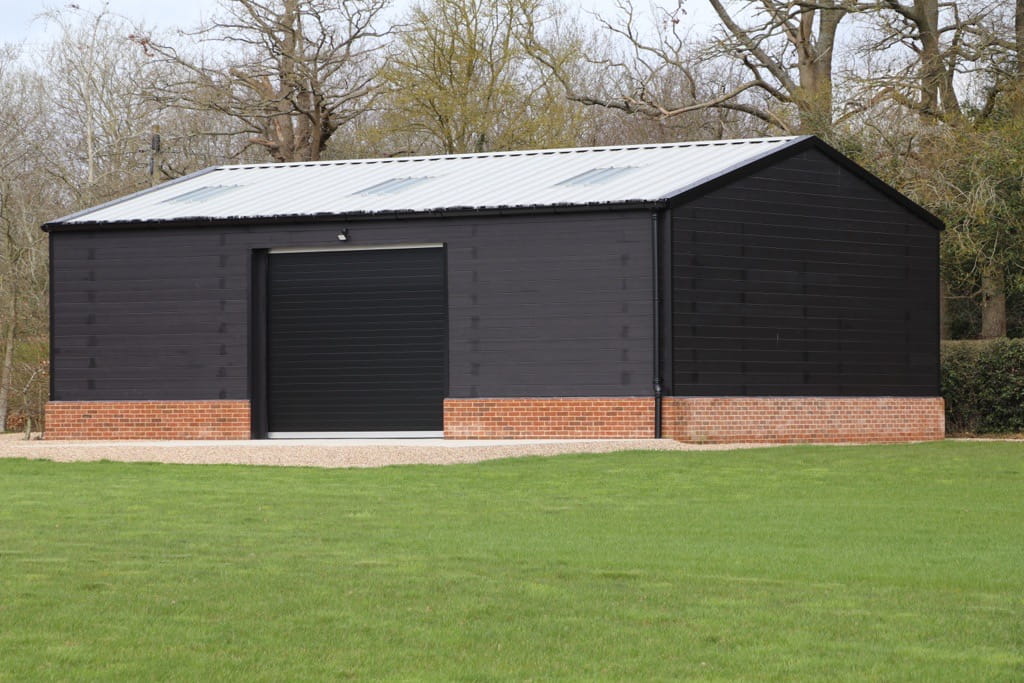 12m x 9m steel portal frame workshop with roller shutter door to centre bay