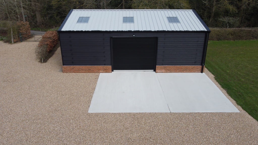 12m x 9m steel portal frame general purpose workshop with black hardie plank cladding and composite roof