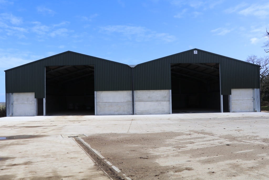 Front view of twin apex grain store with 2 roller shutter doors and 2 personnel doors